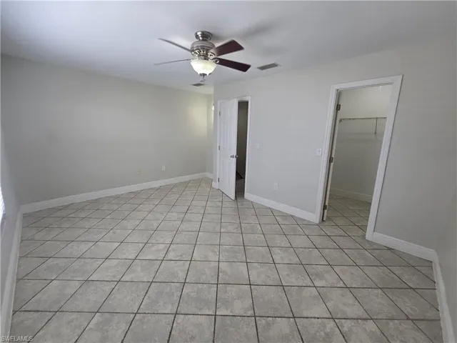 Niche in corner, tiled floor, walk-in closet