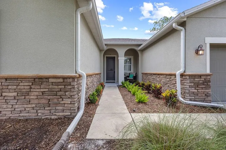 Property entrance with a garage