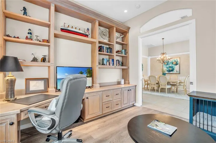 Office area featuring an inviting chandelier and light hardwood / wood-style flooring