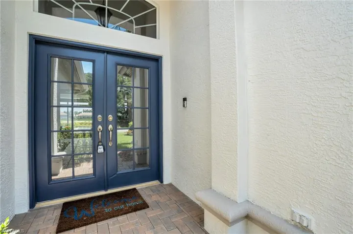 Doorway to property featuring french doors