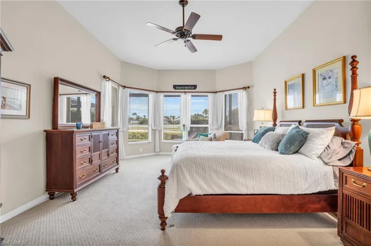 Bedroom with light carpet and ceiling fan