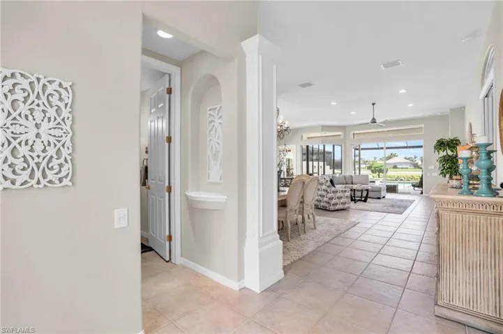 Hall featuring light tile patterned floors