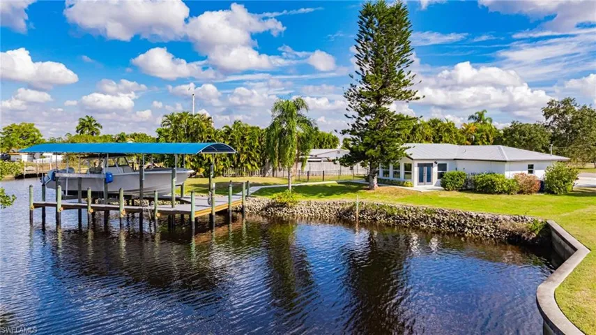 Dock with a water view and boat lift