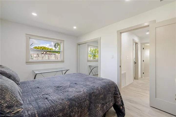 Bedroom featuring a closet, light wood-type flooring, and recessed lighting