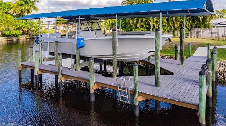 Dock featuring a water view and boat lift