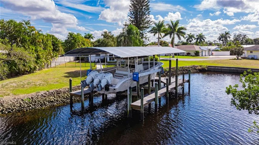 Dock featuring a water view and boat lift