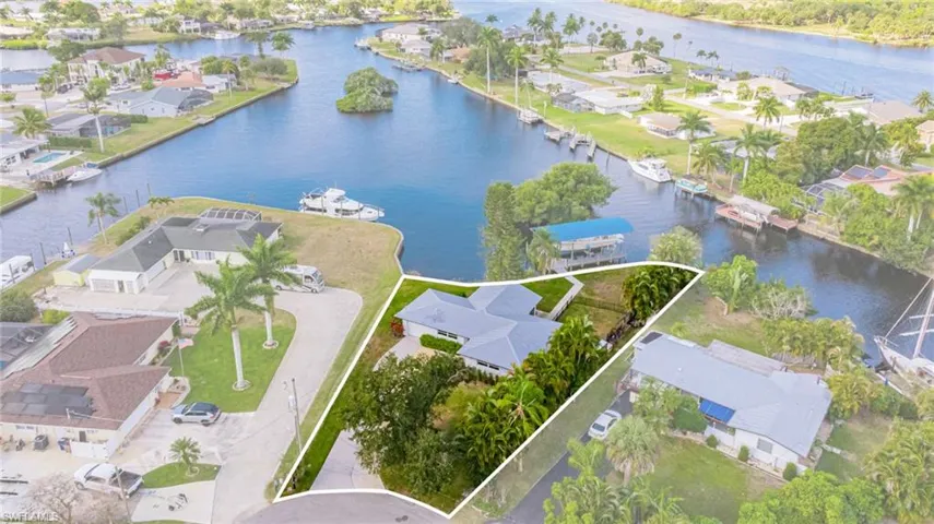 Aerial perspective of suburban area with a nearby body of water