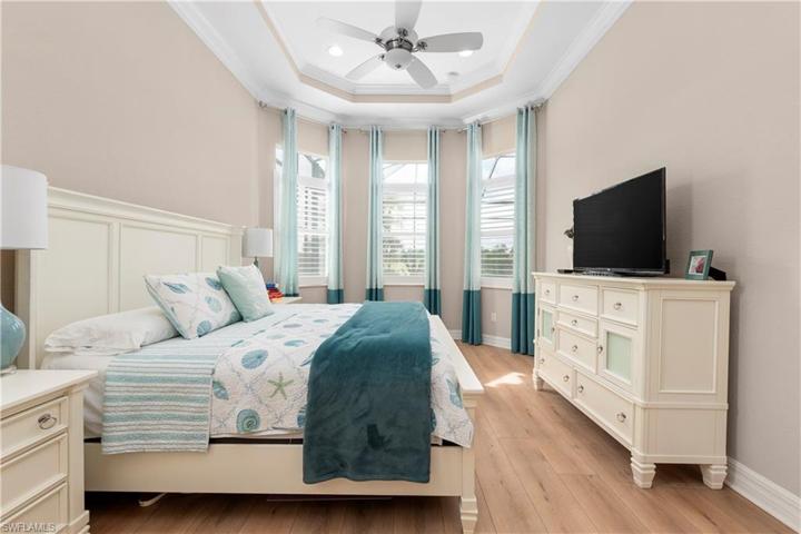 WOOD FLOOR IN PRIMARY BEDROOM