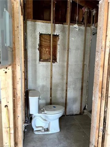Bathroom with tile patterned flooring and toilet
