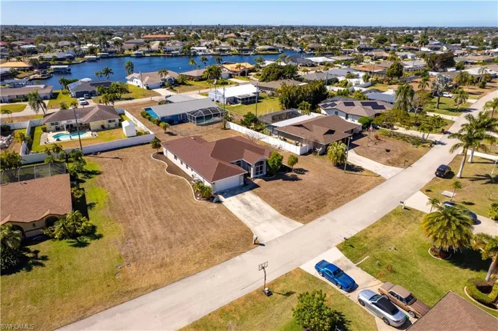 Aerial perspective of suburban area with a large body of water