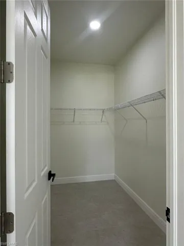 Walk in closet featuring tile patterned floors