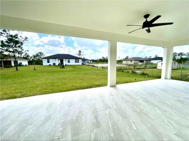 View of patio featuring ceiling fan