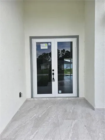 Entrance to property featuring french doors