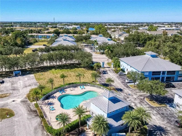 Aerial perspective of suburban area with a pool