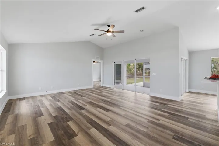 Living room from Master Bedroom across to kitchen and formal dining