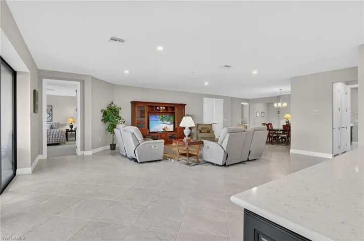 Living room featuring recessed lighting and light tile patterned floors