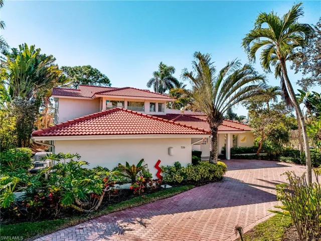 Mediterranean / spanish-style home with stucco siding and a tile roof