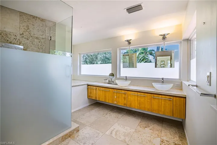 Full bath with double vanity and walk in shower