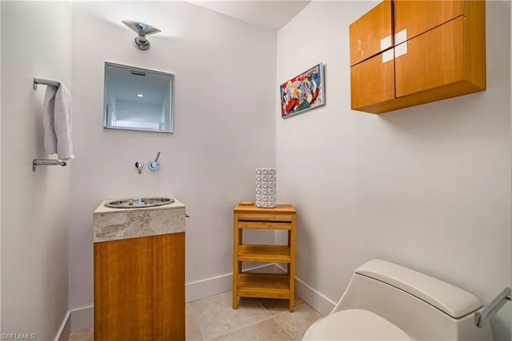 Bathroom featuring vanity and light tile patterned floors