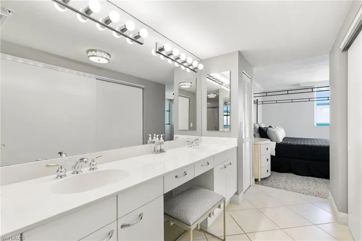 Bathroom featuring dual vanity and tile patterned flooring