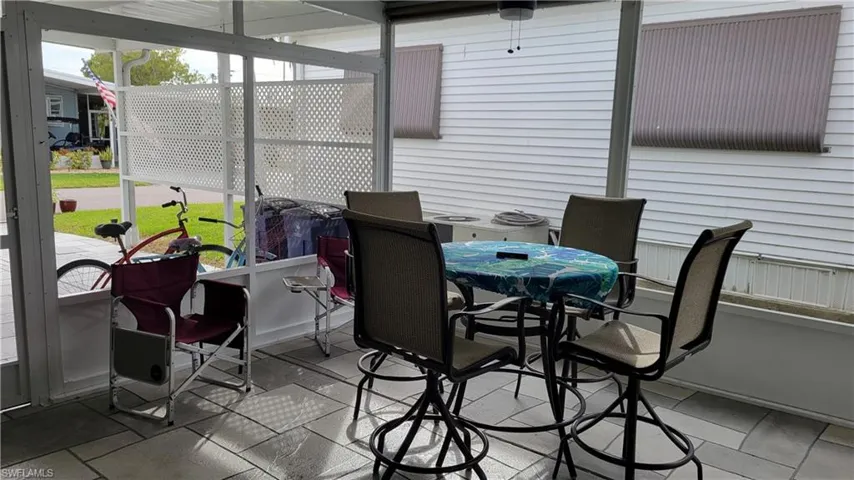 View of sunroom / solarium with ceiling fan