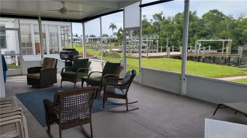 River side Sunroom featuring a healthy amount of sunlight and ceiling fans