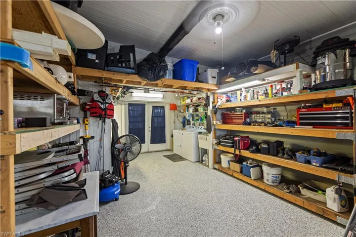 Storage room with washer and clothes dryer