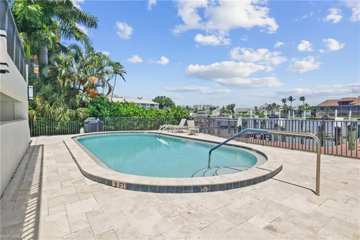 Community pool with a patio area