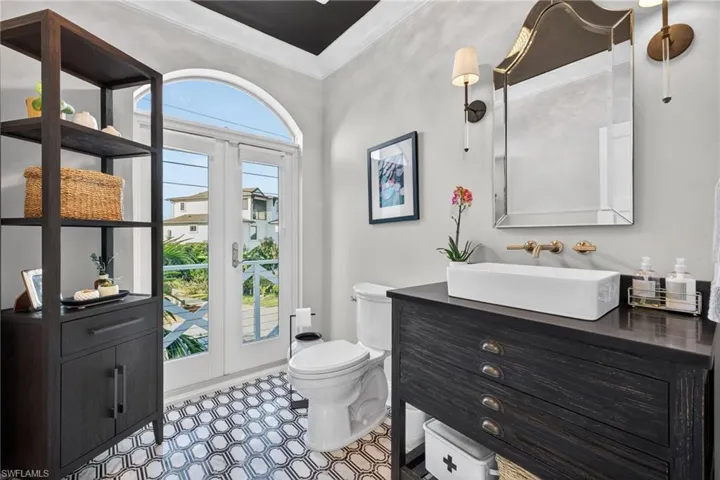 Bathroom with vanity and crown molding