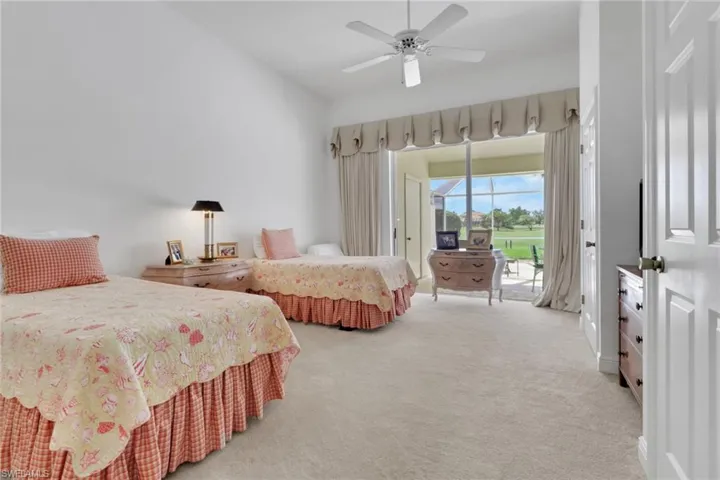 Bedroom with access to outside, light colored carpet, and ceiling fan