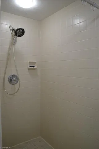 Bathroom featuring tiled shower
