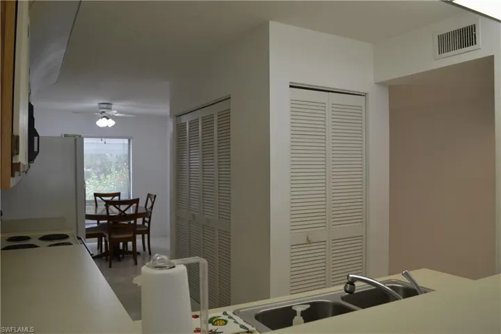 Kitchen with a ceiling fan and a sink