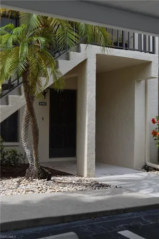 Entrance to property featuring stucco siding