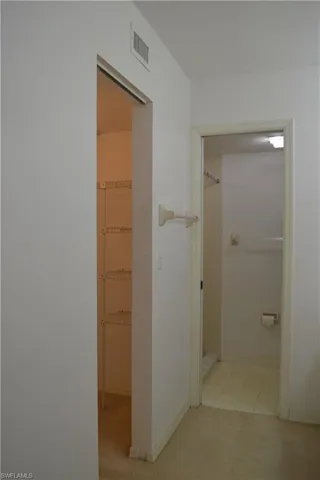 Hallway featuring carpet floors