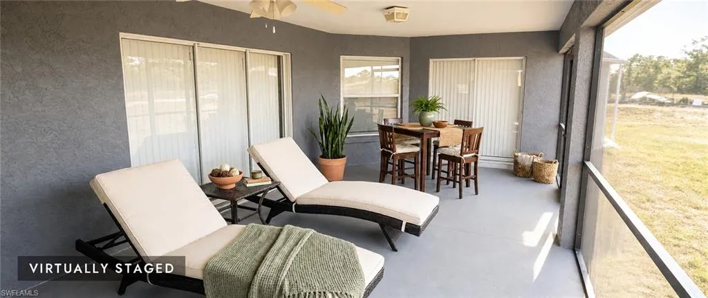 Screened patio featuring a ceiling fan, recessed lighting, and sliding glass doors