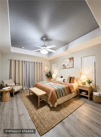 Master w/Tray ceiling with recessed lighting and a ceiling fan
