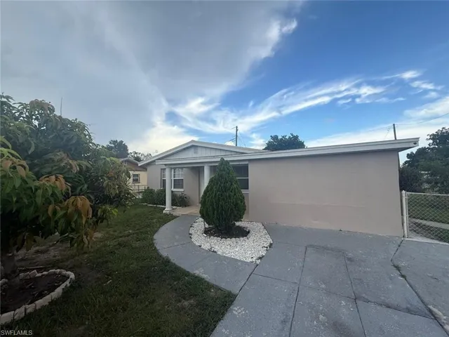 View of front of home featuring stucco siding
