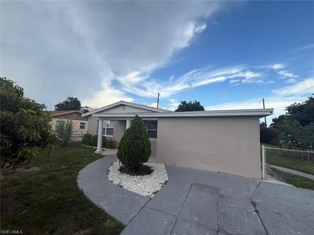 View of front facade with stucco siding