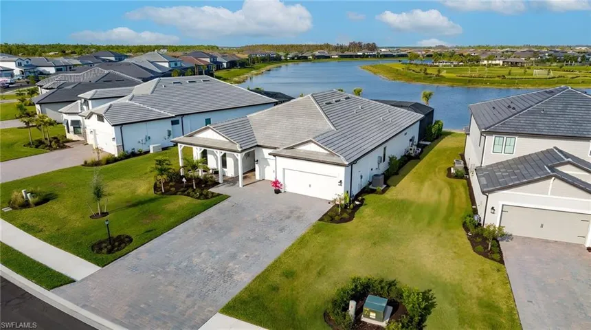 Aerial view of residential area with a nearby body of water