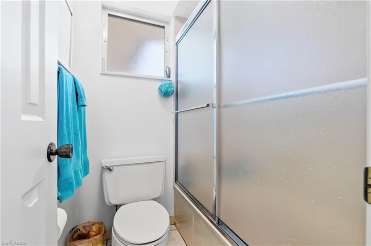 PRIVATE COMMODE AREA IN GUEST BATH.