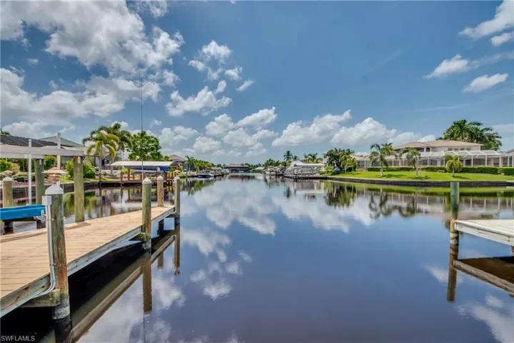 Dock with a water view and a residential view