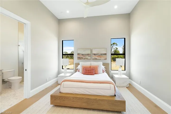 Bedroom featuring light wood-type flooring and a ceiling fan