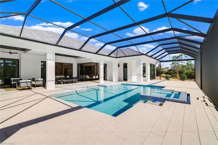 Laundry room fI)eaturing light wood-style floors, cabinet space, washer and dryer, and recessed lighting