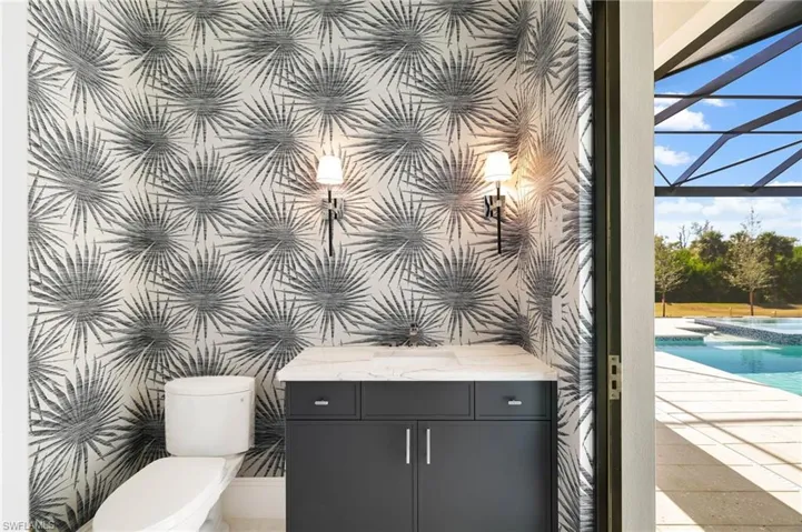 Integrated pool / S spa featuring I a sunroom, a lanai, a patio area, and outdoor dining space