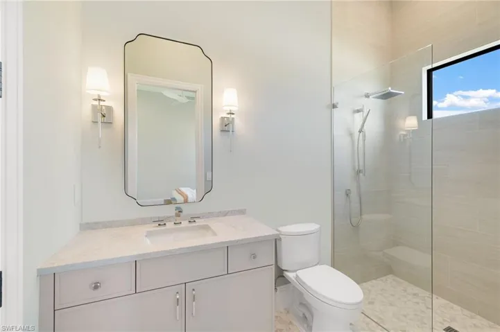 Bathroom with vanity and walk in shower