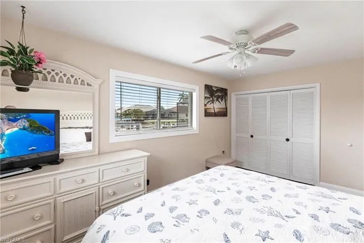 Bedroom featuring a closet and ceiling fan