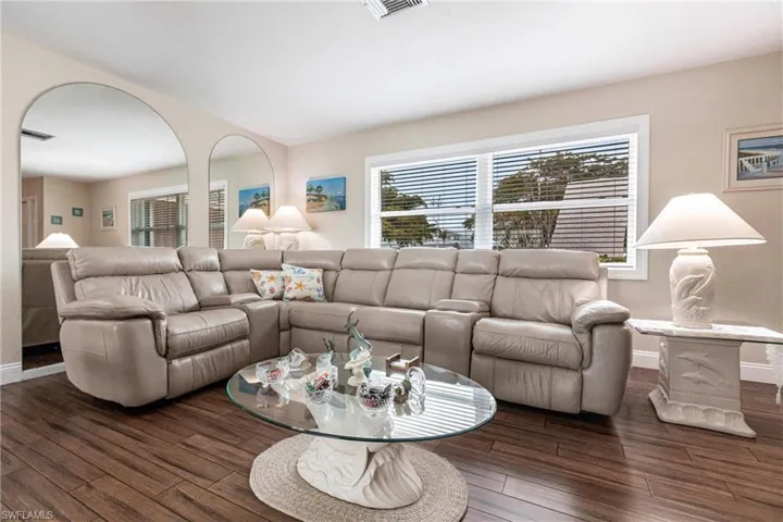 Living room featuring dark hardwood / wood-style flooring