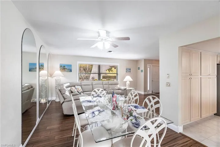 Dining room featuring ceiling fan and dark hardwood / wood-style flooring