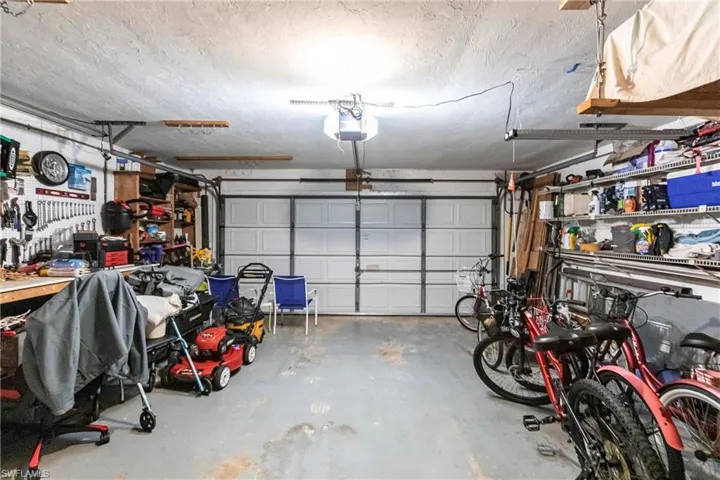 Garage featuring a garage door opener