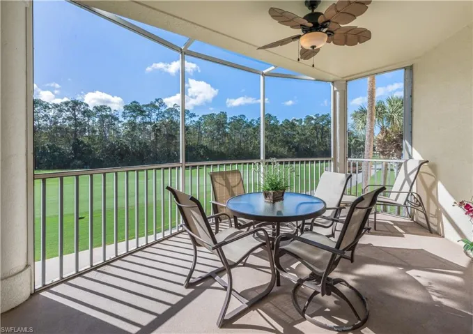 Sunroom featuring a ceiling fan